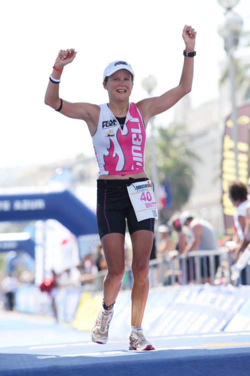 Britta Martin of Nelson crosses the finish line in fourth place at Ironman France in Nice, Sunday July 27, 2010
